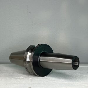 cnc tool holder in front of a off white background for sale