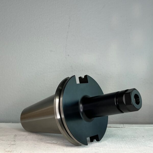 cnc tool holder in front of a off white background for sale