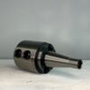 cnc tool holder in front of a off white background for sale