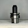 cnc tool holder in front of a off white background for sale