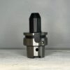 cnc tool holder in front of a off white background for sale